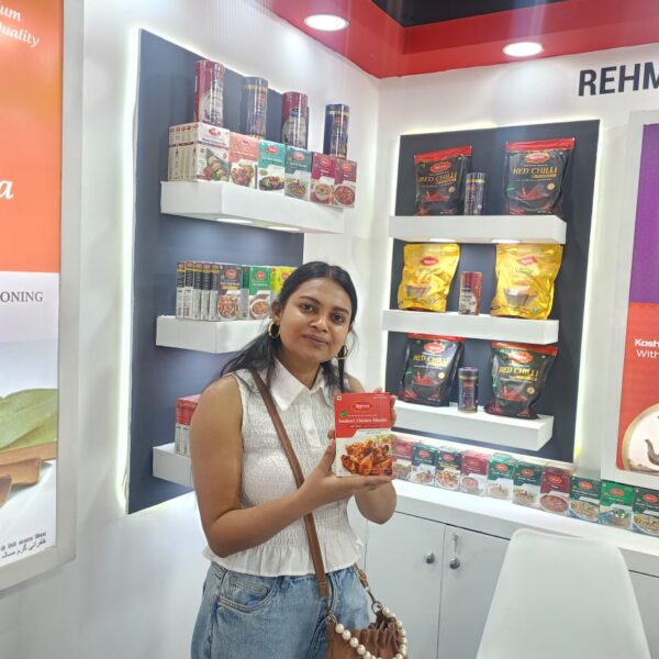 A visitor exploring & appreciating the packaging of our Rehmat Tandoori Masala.